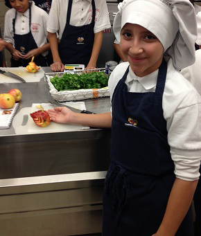 Student with chef hat and food