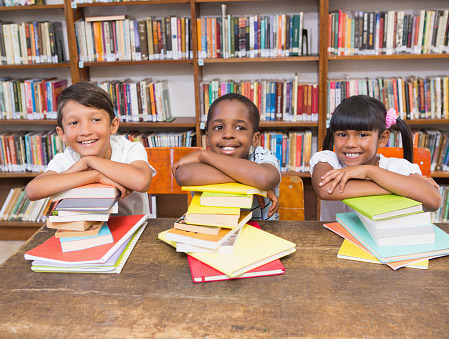 Smiling kids with books